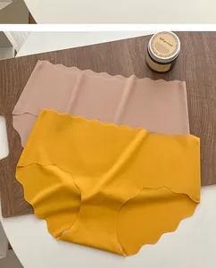 Flat lay of seamless ice silk underwear in ginger and nude pink with wavy laser-cut edges