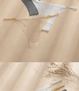 Detail of seamless ice silk thongs with gold metal ring buckles in neutral colors