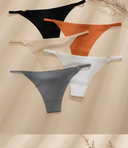 Detail of seamless ice silk thongs with ultra-thin straps and gold metal ring accents