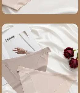 Detail of seamless ice silk thongs in beige and brown colors on silk background