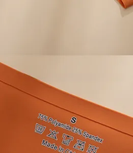 Detail view of the orange ice silk fabric label showing 75% polyamide and 25% spandex material