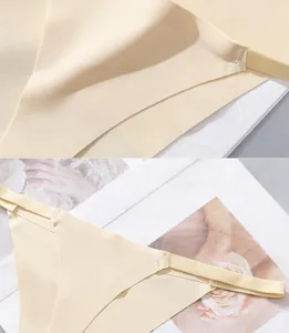 Detail of seamless beige ice silk panties with laser-cut edges and precise stitching