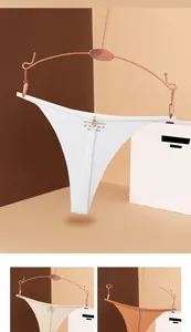 Detail of thin waist straps with metal rings on seamless ice silk thong underwear