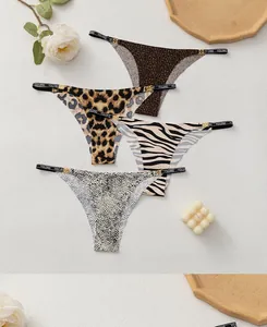 Detailed view of assorted animal print thongs with gold metal buckles and branded elastic straps