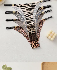 Detail of leopard print thong with gold metal rings and branded elastic waistband