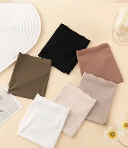 Flat lay of seamless ribbed ice silk panties showing various colors and wavy edges