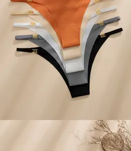 Detail of seamless ice silk thongs featuring iconic triple-ring gold metal connectors