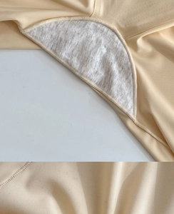 Detail of breathable gray cotton crotch lining and seamless beige stretch fabric texture