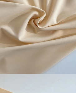 Macro shot of high-density cream ice silk fabric texture with elegant twill pattern details