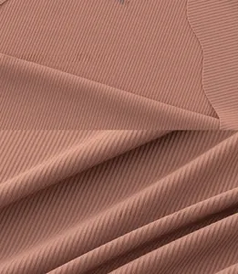 Macro detail of ribbed ice silk fabric for seamless panties in bean paste red color