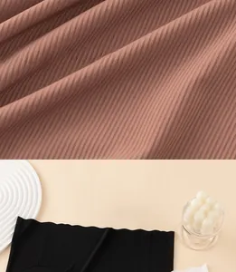 Detailed macro view of seamless wavy edge and ribbed texture on ice silk panties