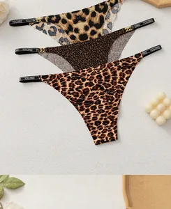Detailed view of leopard print thongs with gold ring link and branded elastic waistband