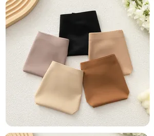Flat lay of seamless low-rise underwear set in five neutral earth tones and soft fabric