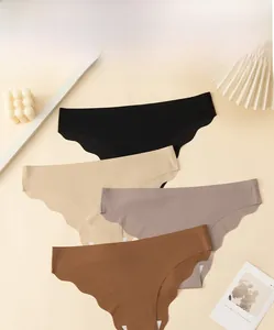 Detail of four seamless laser-cut panties in black beige and brown with wavy edges