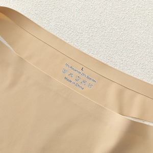 Seamless large size low waist breathable women panties in beige with printed size detail