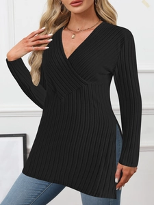 Detail of V-neck wrap top featuring ribbed knit fabric and side slits for women