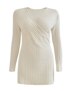 Close-up of beige ribbed knit texture and crossover deep V-neckline of long sleeve top
