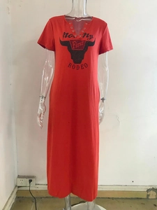 Detail of red maxi dress with V-neck metal eyelets and vintage bull graphic print