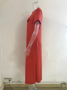 Detail view of red short sleeve maxi dress with round neck and bull graphic print