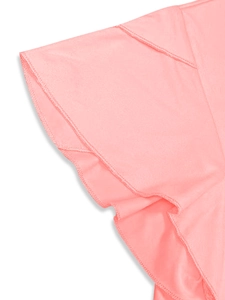 Detailed close-up of pink layered ruffle sleeves with fine stitched edges on a dress
