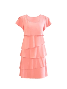 Detail of coral pink tiered ruffle dress featuring layered cap sleeves and round neck
