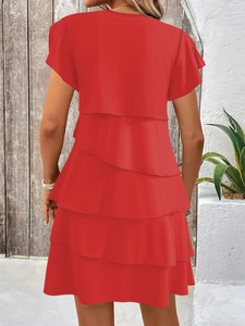 Rear view of a tiered red summer dress featuring layered ruffles and a round neck