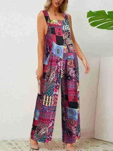 Detail of bohemian patchwork print jumpsuit with wide leg design and adjustable waist belt