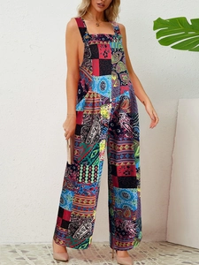 Detail of vibrant paisley print on a wide-leg sleeveless jumpsuit for women