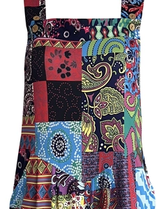 Detail of bohemian patchwork jumpsuit showing paisley prints and wooden buttons
