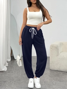 Women's high waist drawstring joggers in navy blue with side pockets and elastic cuffs