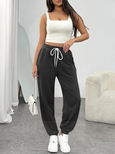 Women's dark grey high-waisted joggers with drawstring and elastic cuffs