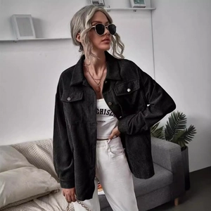 Women's black corduroy oversized shirt jacket with chest pockets and button-down front