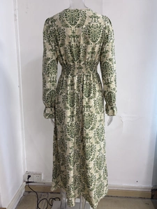 Detail view of green damascus print and elastic waist on long sleeve vintage maxi dress