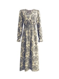 Detail of V-neckline and baroque floral print on long sleeve vintage dress
