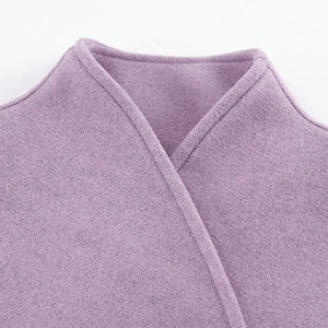 Detail view of lilac wool coat featuring high collar and soft cashmere texture