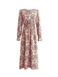 Detailed view of the V-neckline and vintage red damask print on the long-sleeved dress