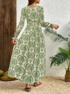 Detail of high waist elastic band and vintage damask print on long sleeve maxi dress