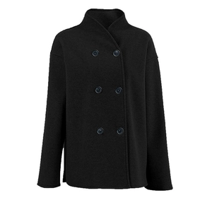 Detail view of double-breasted black wool coat featuring premium textured fabric and buttons