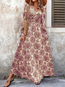 Bohemian V-neck maxi dress with vintage red-brown floral prints on cream fabric