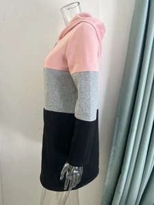 Side view of long-sleeve hoodie featuring a pink, grey, and black color-block design