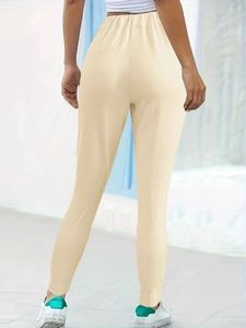 Women's apricot casual jogger pants featuring an elastic waist and cinched leg cuffs
