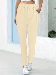 Women's light beige jogger pants with elastic waist and side pockets for casual wear