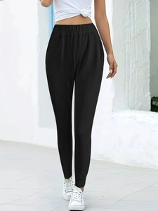 Women's black joggers with elastic waist and ribbed cuffs for athletic leisure wear