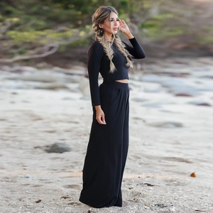 Outdoor shot of black long sleeve crop top and high waist wide leg pants set