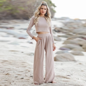 Detail of taupe knit set showing high waist wide leg pants with side pockets and soft texture