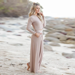 Detail of elegant two-piece loungewear set featuring wide-leg pants and long-sleeve top