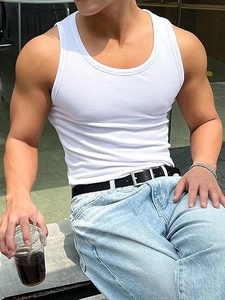 Close-up of white ribbed tank top fabric with durable stitching for men's summer fitness