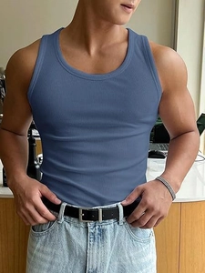 Detail of blue ribbed knit fitness tank top showing slim fit texture and crew neck