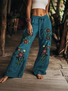 Donkerblauwe linnen broek met wijde pijpen, bloemenborduursels en elastische trekkoordtaille
