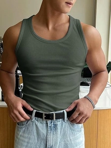 Close-up of olive green ribbed tank top showing vertical knit texture and neckline